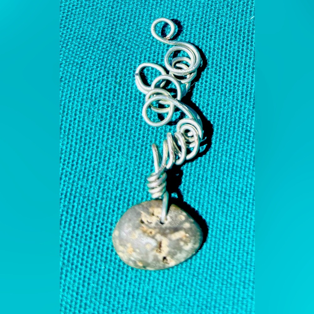 Hand wire wrapped natural finger lakes lucky stone pendant.
